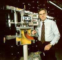 Carl Hammonds standing beside industrial equipment